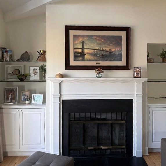 Beautiful fireplace with built-ins on either side.